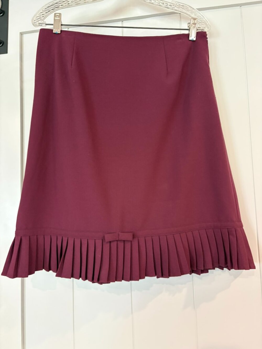 Larry Levine maroon skirt with pleats and bow, size 10